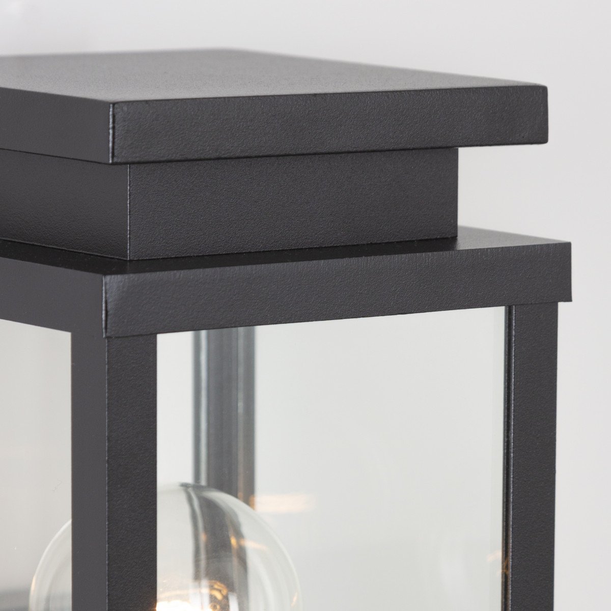 black wall lamp with square shape and windows with real glass